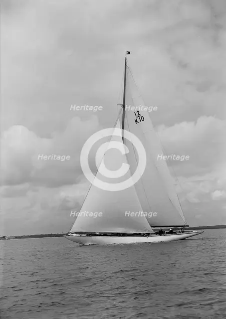 'Trivia', a 12 Metre class yacht sails close-hauled, 1939. Creator: Kirk & Sons of Cowes.