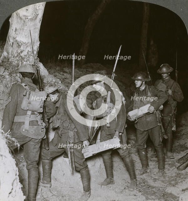 Troops on a night raid leave by a sap for the enemy lines, 20th century. Artist: Realistic Travels Publishers