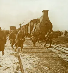 Troops disembarking from steam train, c1914-c1918