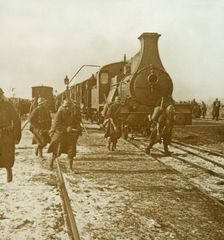Troops disembarking from steam train, c1914-c1918