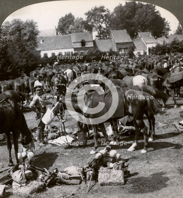 Troops feeding their horses and resting on the march, World War I, 1914-1918.Artist: Realistic Travels Publishers