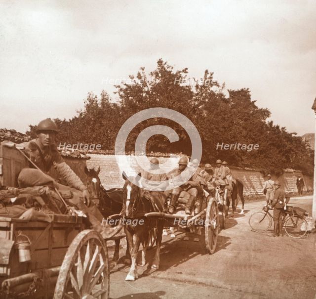 Troops in horse-drawn carts, Raux, France, c1914-c1918. Artist: Unknown.