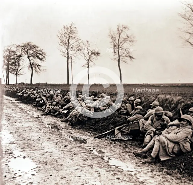 Troops resting by the side of a road, northern France, c1914-c1918. Artist: Unknown.