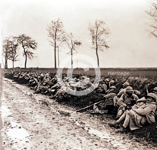 Troops resting by the side of a road, northern France, c1914-c1918. Artist: Unknown.