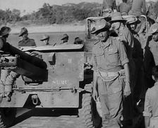 Troops Standing by an Artillery Gun on Grub Bridge 1943. Creator: British Pathe Ltd