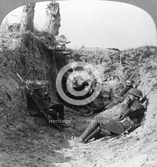 Troops waiting in a trench near Arras, France, World War I, c1914-c1918.  Artist: Realistic Travels Publishers