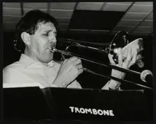 Trombonist Derek Wadsworth playing at The Fairway, Welwyn Garden City, Hertfordshire, 28 July 1991. Creator: Denis Williams