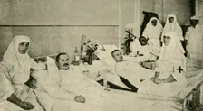 Tsarina Alexandra nursing wounded soldiers, 1914, (c1920). Creator: Unknown