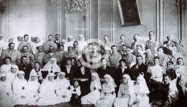 Tsarina Maria Fyodorovna of Russia visiting a hospital in Kiev, 1915. Artist: Unknown
