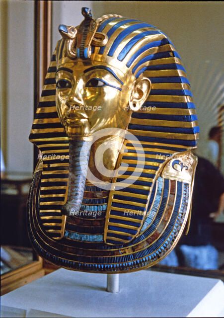 Tutankhamun death mask made of solid gold encrusted with precious stones, found by H. Carter in 1…