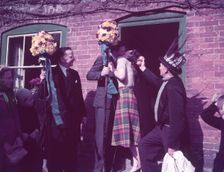 Tutti Men claiming a kiss, Hocktide Festival, Hungerford, Berkshire, c1955. Creator: Arthur Charles Kirby Ware