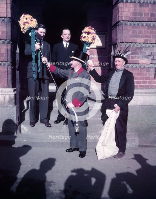 Tutti Men recieving Tutti Poles, Hocktide Festival, Hungerford, Berkshire, c1955. Creator: Arthur Charles Kirby Ware.