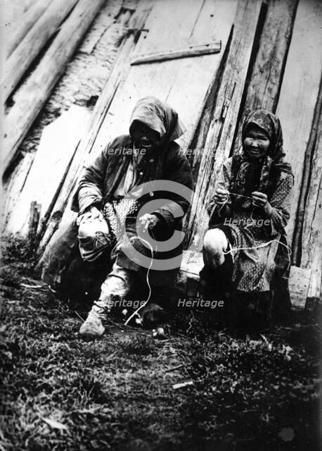 Tutur Tungus. Dudovka camp. Old women twist threads from deer tendons, 1920-1939. Creator: Unknown.