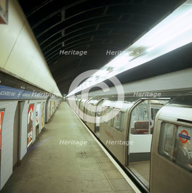 Tube train standing at Blackhorse Road station on the Victoria Line, London, 1974.  Creator: Michael Walters.