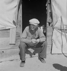 Tubercular migrant in a potato pickers camp, Kern County, California, 1937. Creator: Dorothea Lange