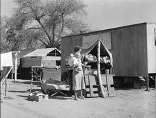Tubercular mother from Oklahoma now living in the Kern migrant camp (resettlement), CA, 1936. Creator: Dorothea Lange
