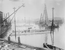 Tubes for subway line under Harlem River, being sunk, between c1910 and c1915. Creator: Bain News Service