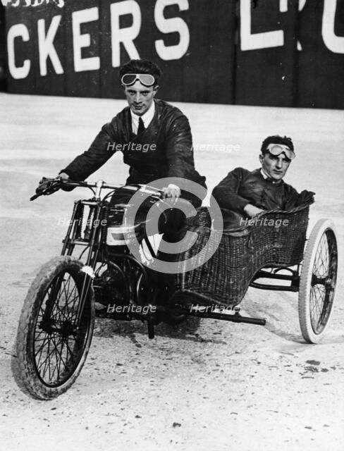 Tudor and Thompson riding a motorcycle and sidecar. Artist: Unknown