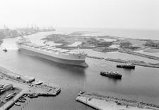 Tugboats assist the M/S Varenna to leave Landskrona shipyard, Sweden, c1970. Creator: Unknown