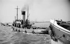 Tugs leaving the Royal Terrace Pier at Gravesend, Kent, c1945-c1965. Artist: SW Rawlings