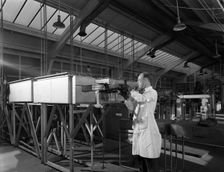 Tungsten carbide furnace being loaded, Edgar Allen Steel Co, Sheffield, South Yorkshire, 1962. Creator: Michael Walters