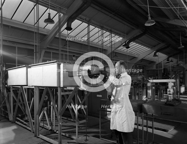 Tungsten carbide furnace being loaded, Edgar Allen Steel Co, Sheffield, South Yorkshire, 1962. Creator: Michael Walters.