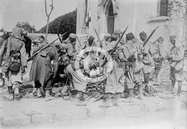 Turcos Examining War Booty at Neufmentiers, 1914. Creator: Bain News Service.