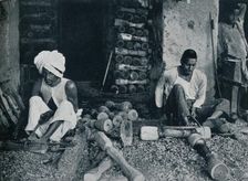 Turning wooden bed legs c1942
