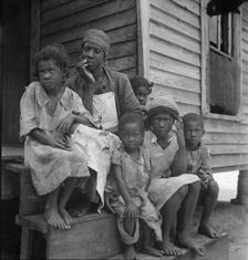 Turpentine worker's family near Cordele, Alabama, 1936. Creator: Dorothea Lange