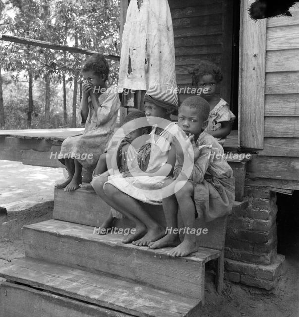Turpentine worker's family near Cordele, Alabama, 1936. Creator: Dorothea Lange.