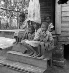 Turpentine worker's family near Cordele, Alabama, 1936. Creator: Dorothea Lange