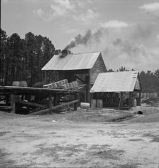 Turpentine still in the Piney Woods near Valdosta, Georgia, 1937. Creator: Dorothea Lange