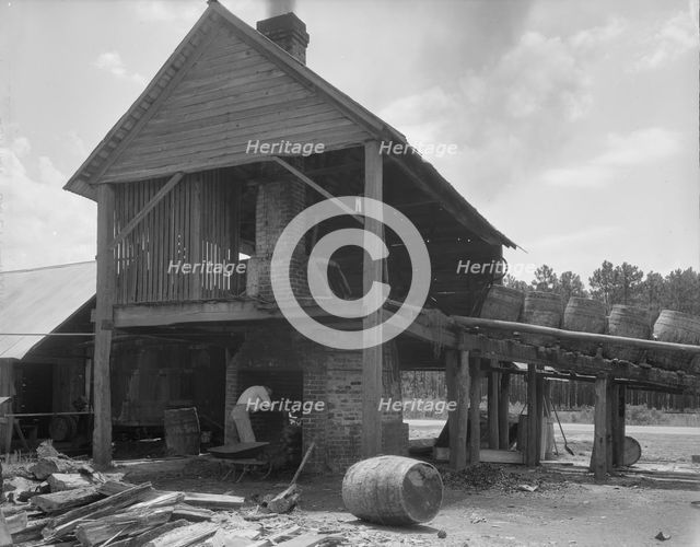 Turpentine still in the Piney Woods near Valdosta, Georgia, 1937. Creator: Dorothea Lange.