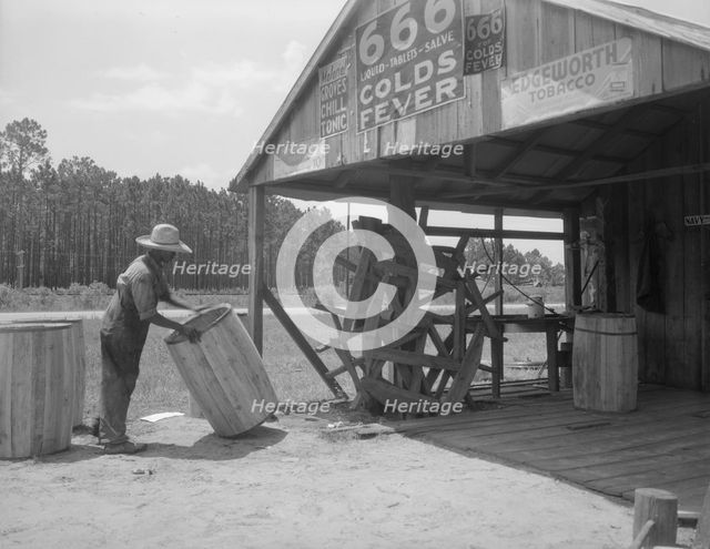 Turpentine still near Valdosta, Georgia, 1937. Creator: Dorothea Lange.