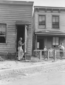 Twelve dollars a month for three rooms, Housing, Richmond, Virginia. , 1938. Creator: Dorothea Lange