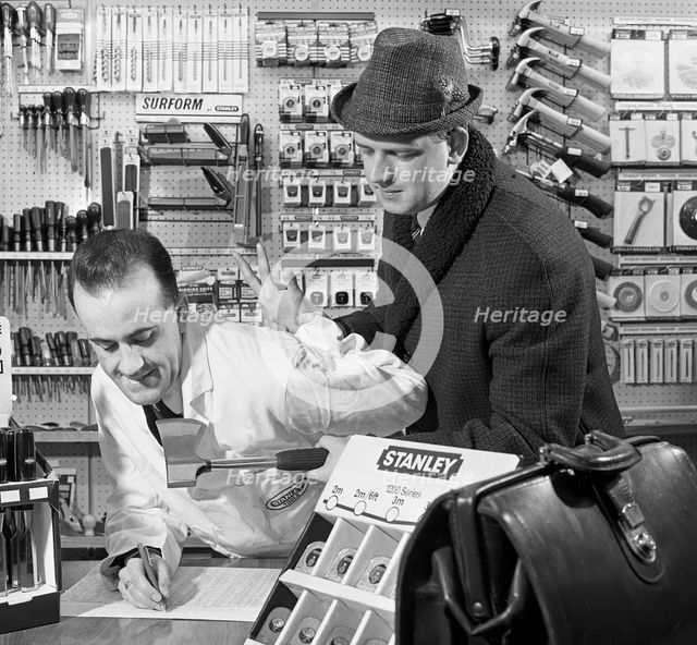 Twist your arm for an order, 1967.  Creator: Michael Walters.