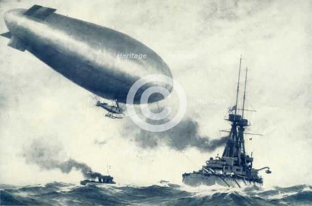 'Twixt Sea and Sky. British Airship Towed by Warship', 1917. Creator: Unknown.