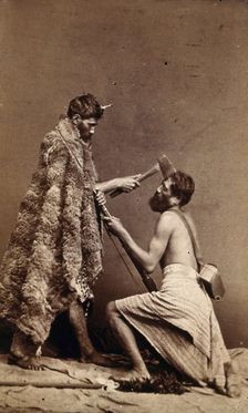 Two Maori men, simulating armed attack with a hatchet and a spear(?), c1880s. Creator: Unknown
