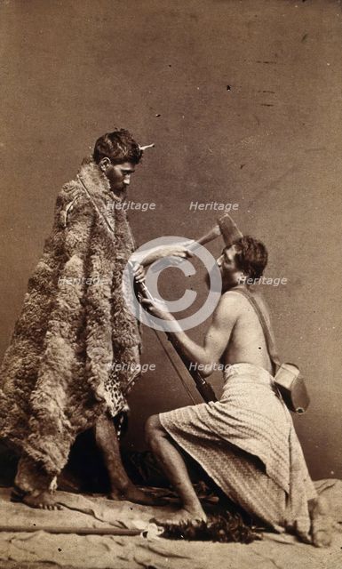 Two Maori men, simulating armed attack with a hatchet and a spear(?), c1880s. Creator: Unknown.