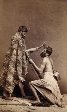 Two Maori men, simulating armed attack with a hatchet and a spear(?), c1880s. Creator: Unknown