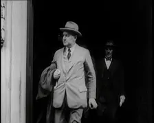 Two Male Civilians Emerging from a Building, 1924. Creator: British Pathe Ltd