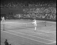 Two Male Civilians Playing a Match of Tennis at Centre Court at the All England Lawn Tennis..., 1920 Creator: British Pathe Ltd