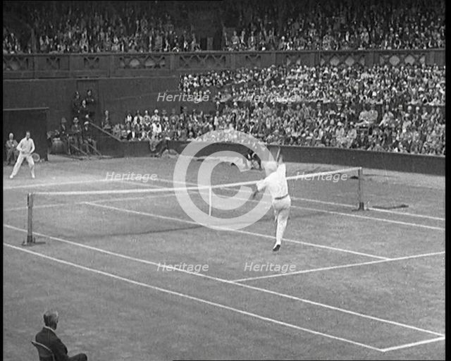Two Male Civilians Playing a Match of Tennis at Centre Court at the All England Lawn Tennis..., 1920 Creator: British Pathe Ltd.
