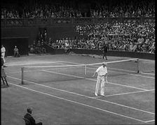 Two Male Civilians Playing a Match of Tennis at Centre Court at the All England Lawn Tennis..., 1920 Creator: British Pathe Ltd