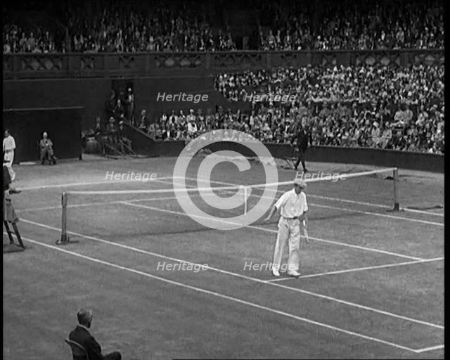 Two Male Civilians Playing a Match of Tennis at Centre Court at the All England Lawn Tennis..., 1920 Creator: British Pathe Ltd.