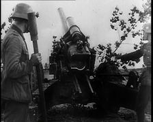 Two Male German Soldiers by an Artillery Gun, 1939. Creator: British Pathe Ltd