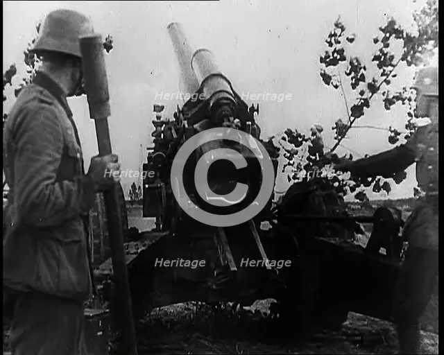 Two Male German Soldiers by an Artillery Gun, 1939. Creator: British Pathe Ltd.