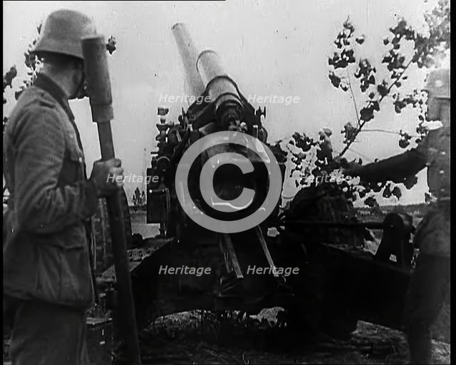 Two Male German Soldiers by an Artillery Gun, 1939. Creator: British Pathe Ltd.