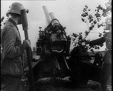 Two Male German Soldiers by an Artillery Gun, 1939. Creator: British Pathe Ltd