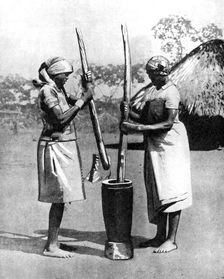 Two Mashona tribeswomen pounding maize and millet, Zimbabwe, Africa, 1936.Artist: Wide World Photos
